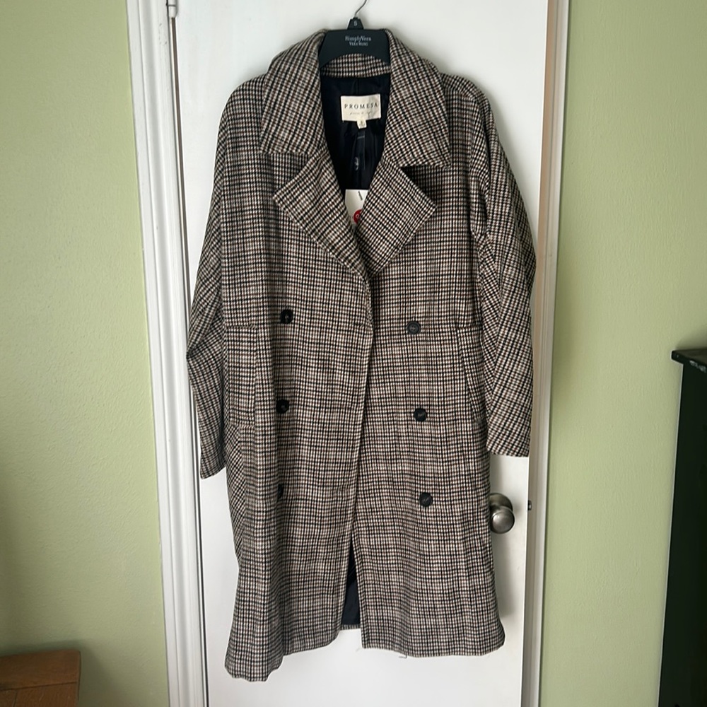 Gorgeous trench coat. Perfect for winter. Brand new with tags. Size small